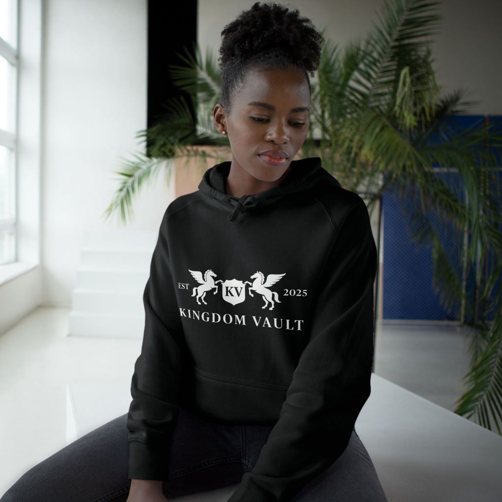 Woman wearing a black Kingdom Vault hoodie featuring the logo with winged horses and shield, promoting Kingdom Vault (www.kingdomvault.ca).