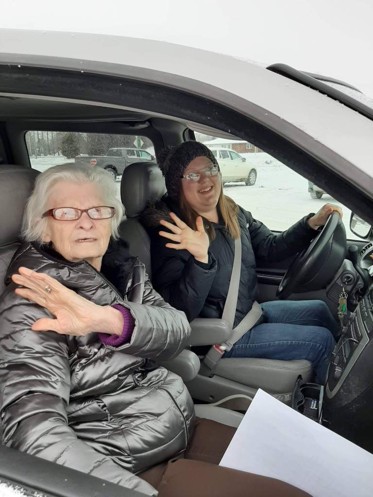 Agnes and Jade Weedmark sitting in Jade's van before delivering meals through the Meals on Wheels program.